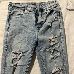 American Eagle jeans. light wash with rips. Size 0 Short.